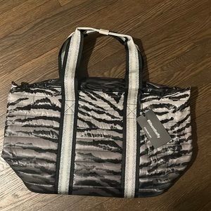 Think Rolyn zebra bag with tags.